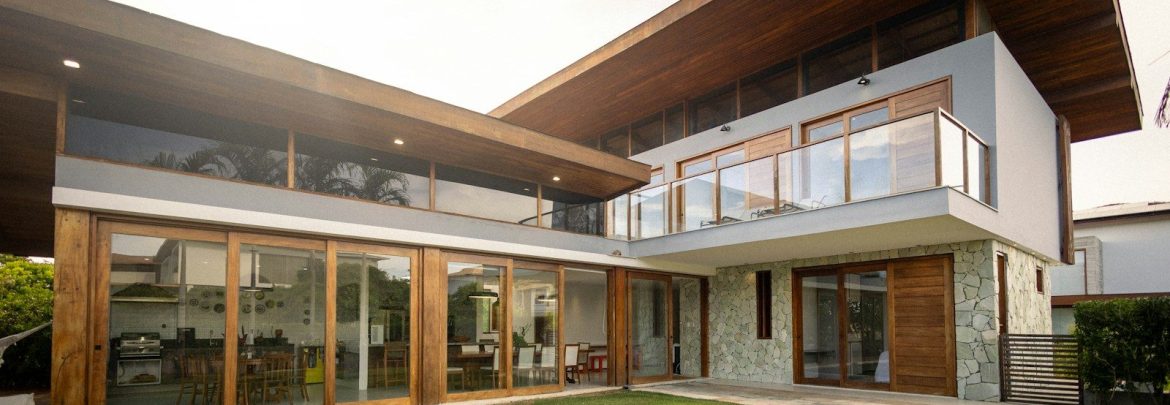 Modern house with large windows and a green lawn